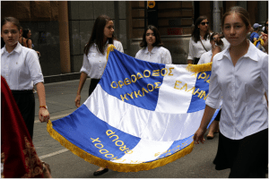 Girls from the Youth Fellowships (Ομάδες) carrying their banner
